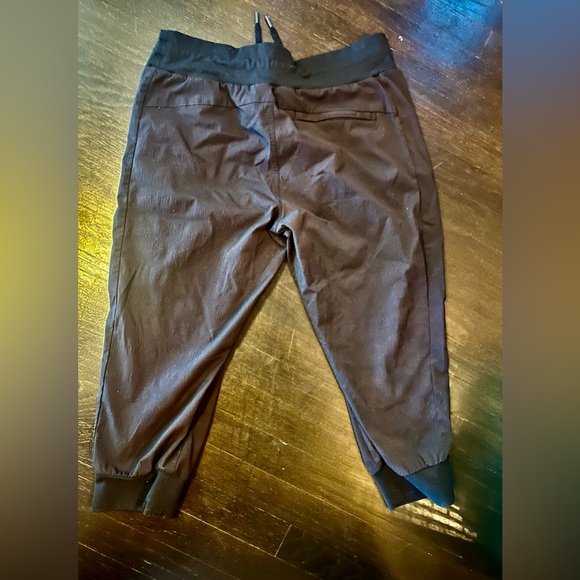 Athleta Women's Black Salutation Joggers with Zippered Pockets. Size 12p - Picture 3 of 5